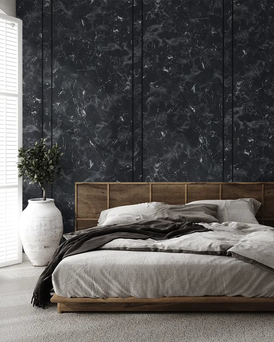 Bedroom with a dark textured laminate wall behind the bed