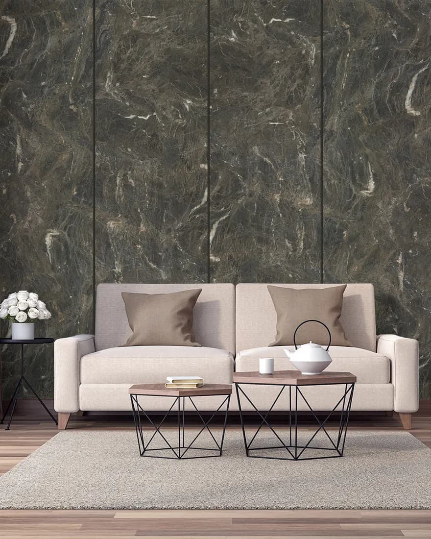 Deep green stone-look laminate feature wall behind a beige sofa