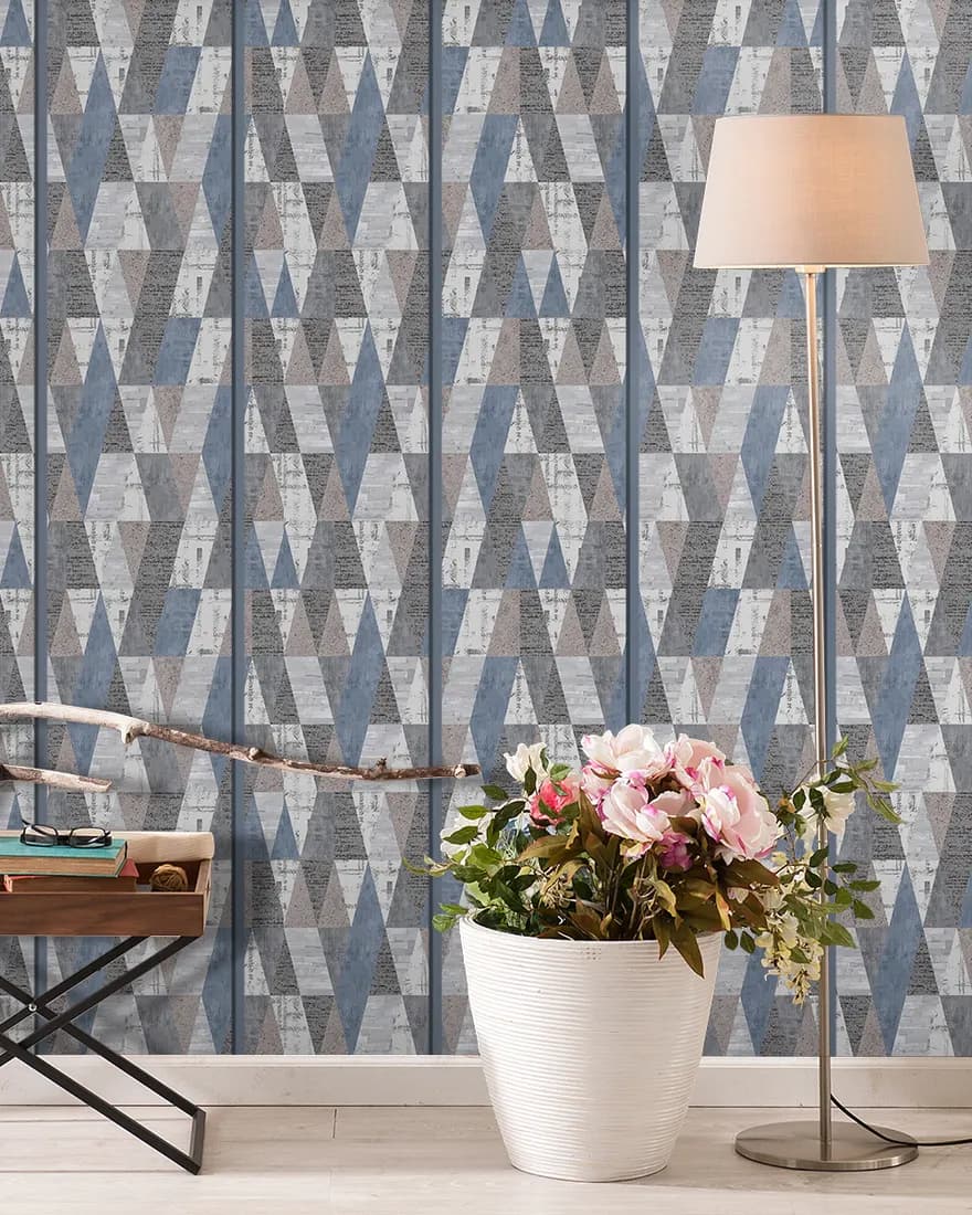 Study corner with a blue geometric laminate wall, desk and flowers
